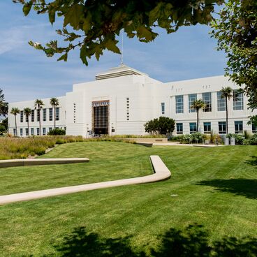 The front of Santa Monica City Hall With a Grass Lawn